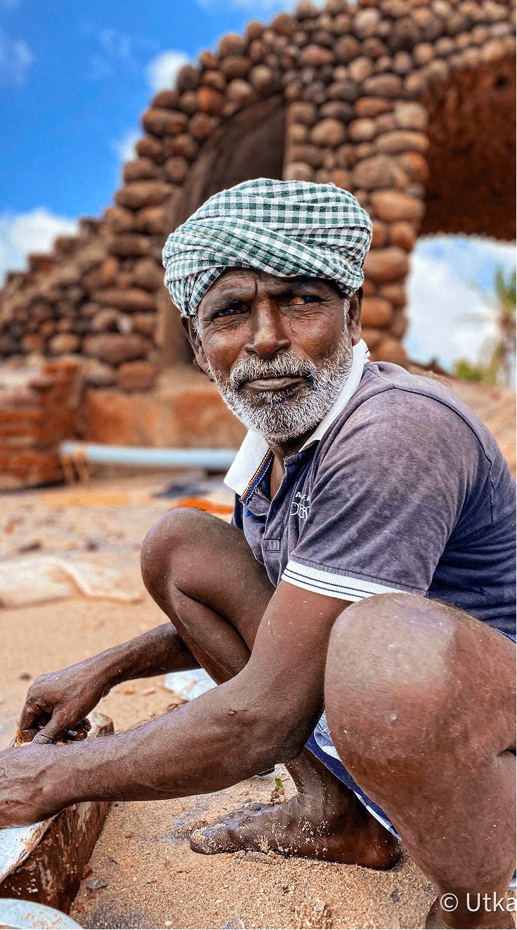 Construction worker with green checked turban